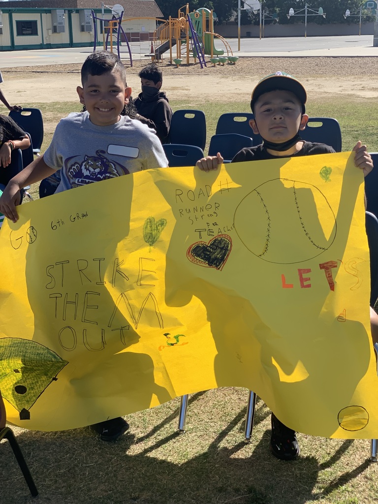 students holding a poster